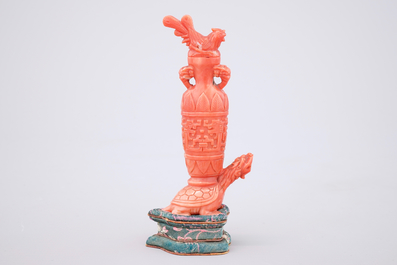 A Chinese carved red coral turtle snuff bottle on stand, 19th C.