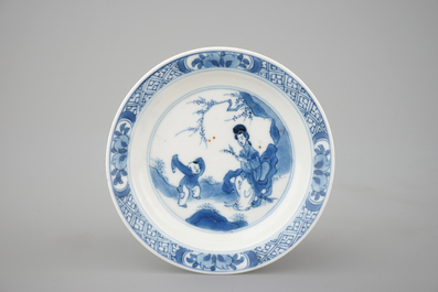 A large collection of Chinese blue and white cups and saucers, mostly Kangxi, 18th C.