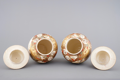 A very tall pair of Japanese Satsuma vases and covers, 19th C.