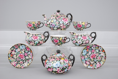 A Chinese black ground and famille rose tea service, ca. 1900, marked Qianlong