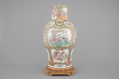 A tall Chinese Canton rose medallion porcelain vase on gilt wood stand, 19th C.