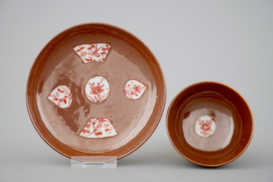 A set of five Chinese batavia brown, gred and gilt cups and saucers, 18th C.