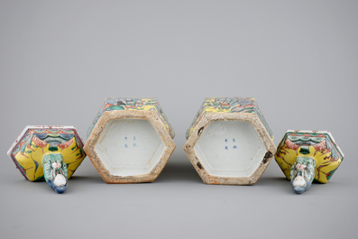 A pair of rare hexagonal Chinese famille jaune porcelain vases with figural covers, 19th C.