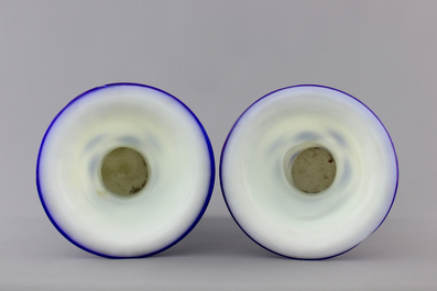 A pair of blue and white Chinese Peking overlay glass yenyen vases, early 20th C.