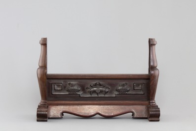 A Chinese dream stone plaque in a carved hardwood stand, 19/20th C.