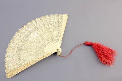 Two Chinese Canton carved and pierced ivory fans, 19th C.