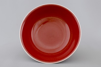 A Chinese porcelain copper-red glazed bowl on foot, 19/20th C.