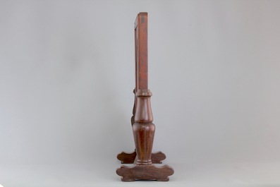 A Chinese dream stone plaque in a carved hardwood stand, 19/20th C.