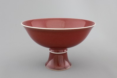 A Chinese porcelain copper-red glazed bowl on foot, 19/20th C.