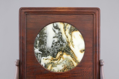 A Chinese dream stone plaque in a carved hardwood stand, 19/20th C.
