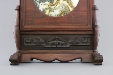 A Chinese dream stone plaque in a carved hardwood stand, 19/20th C.