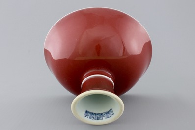 A Chinese porcelain copper-red glazed bowl on foot, 19/20th C.
