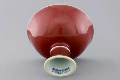 A Chinese porcelain copper-red glazed bowl on foot, 19/20th C.