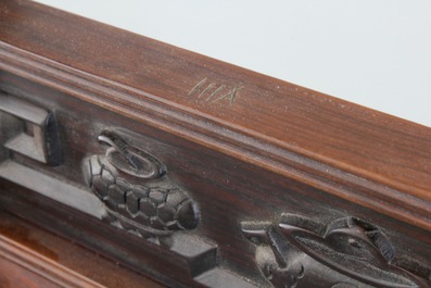 A Chinese dream stone plaque in a carved hardwood stand, 19/20th C.