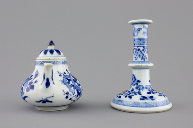 A Chinese blue and white porcelain candlestick and a miniature teapot, 18th C.
