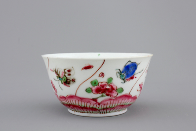 A Chinese porcelain famille rose cup and saucer with insects encircling a rose, Yongzheng-Qianlong, 18th C.