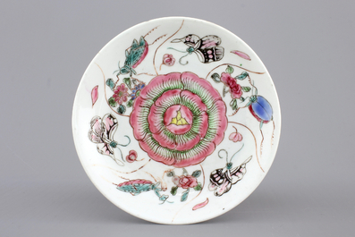 A Chinese porcelain famille rose cup and saucer with insects encircling a rose, Yongzheng-Qianlong, 18th C.