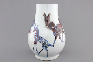 A Chinese hu-shaped deer-handled underglaze red and blue vase with finely painted animals, ca 1900