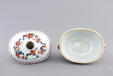 A Chinese porcelain imari tureen and cover on stand, decorated with fish, 18th C.
