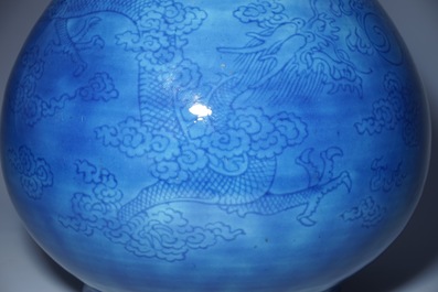 A Chinese monochrome blue garlic vase with incised dragon decoration, 19th C