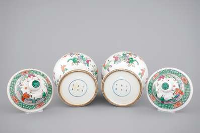 A pair of Chinese vases with covers with playing boys, 19th C.