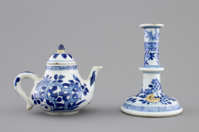 A Chinese blue and white porcelain candlestick and a miniature teapot, 18th C.