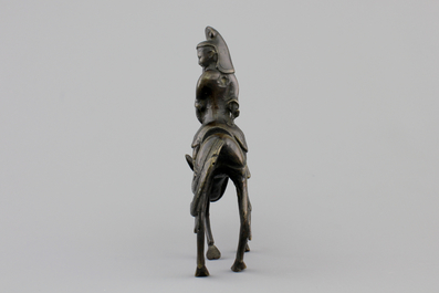 A Chinese bronze figure of a sage on a donkey, 18/19th C