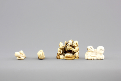 A set of 9 small Japanese ivory carvings, incl. netsuke, on a small red lacquer table, 19th/early 20th C.