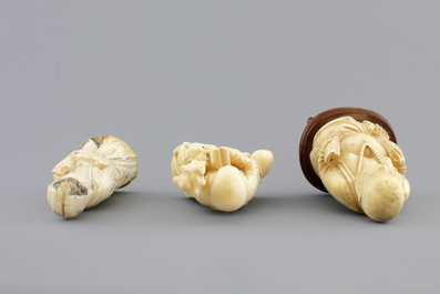 Three Chinese carved ivory figures on wooden stands, ca. 1900