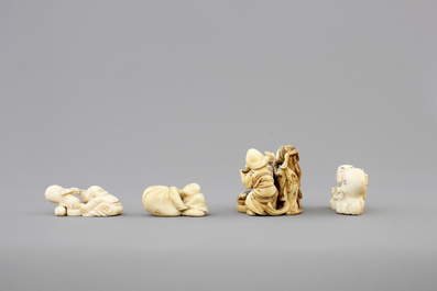 A set of 9 small Japanese ivory carvings, incl. netsuke, on a small red lacquer table, 19th/early 20th C.