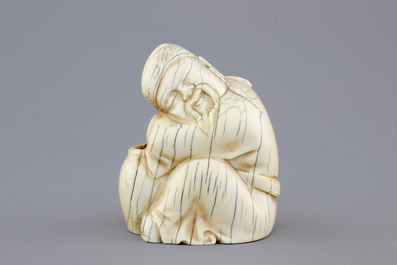 A Chinese carved ivory figure of a sage, signed, 19th C.