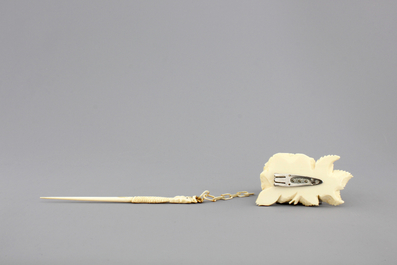 Two Chinese carved ivory figures, a hairpin and a brooch and a Japanese ivory pagoda, 19th C.