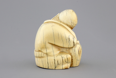 A Chinese carved ivory figure of a sage, signed, 19th C.