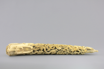 A Chinese ivory carving of a dragon on wooden stand, early 20th C.