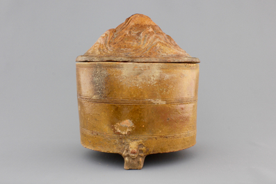A brown-glazed pottery tripod vessel and mountain cover, Han Dynasty (206 BC-220 AC)