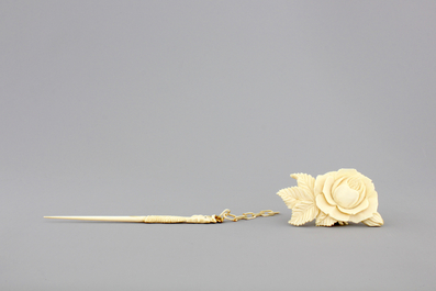 Two Chinese carved ivory figures, a hairpin and a brooch and a Japanese ivory pagoda, 19th C.