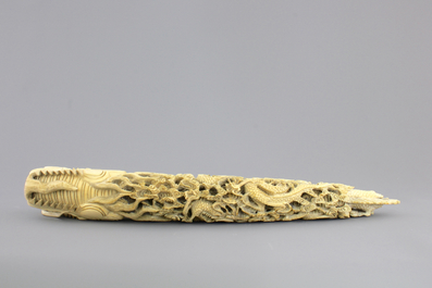 A Chinese ivory carving of a dragon on wooden stand, early 20th C.