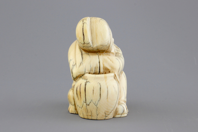 A Chinese carved ivory figure of a sage, signed, 19th C.