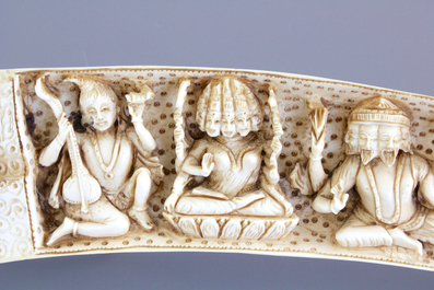 A highly unusual Indian carved open-folding ivory tusk, 19th C.