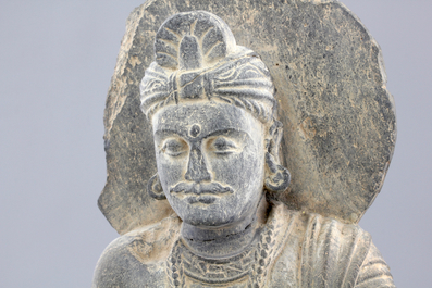 A gray schist figure of a seated Buddha, Gandhara, prob. 2nd/3rd C.