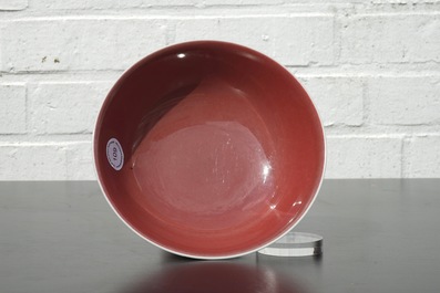 A Chinese porcelain copper-red glazed bowl on foot, 19/20th C.