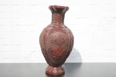 A Chinese carved lacquer vase with a gilt Qianlong mark, 18th C.