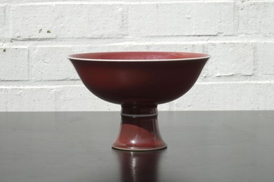 A Chinese porcelain copper-red glazed bowl on foot, 19/20th C.
