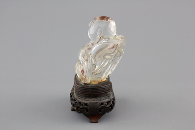 A Chinese rock crystal Buddha on stand, 18/19th C.