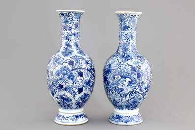 A pair of Chinese porcelain blue and white flower scroll vases, Kangxi, ca. 1700