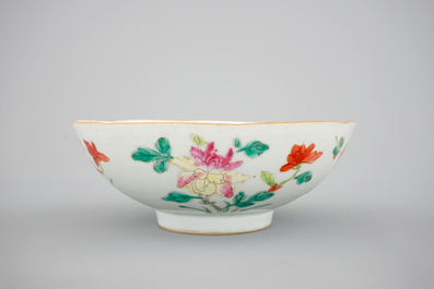 A blue and white Chinese porcelain plate with flowers and a famille rose bowl, 18th C.