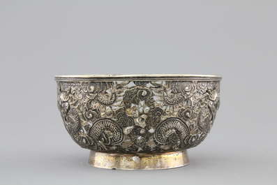 An open-worked Chinese silver dragon bowl, Wang Hing, China, 19th C.