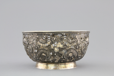An open-worked Chinese silver dragon bowl, Wang Hing, China, 19th C.