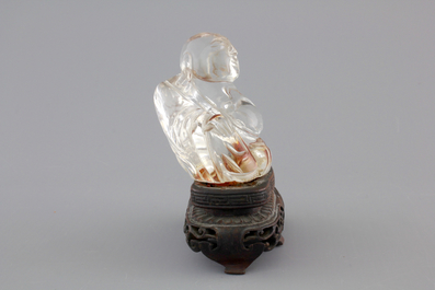 A Chinese rock crystal Buddha on stand, 18/19th C.