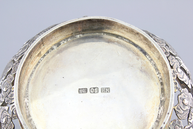 An open-worked Chinese silver dragon bowl, Wang Hing, China, 19th C.